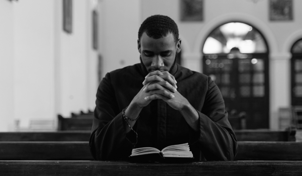 Black man praying