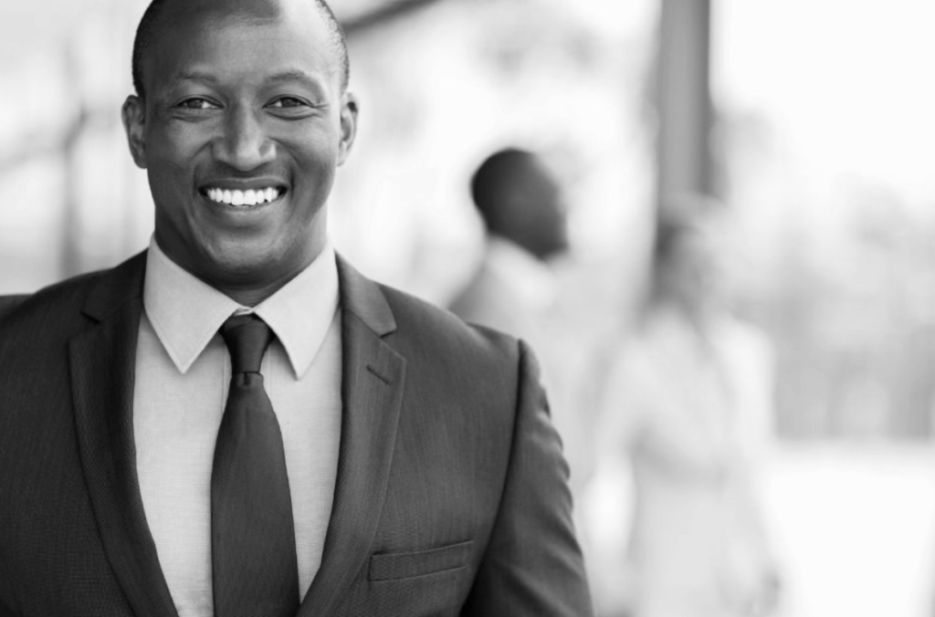 Black man wearing a suite and tie