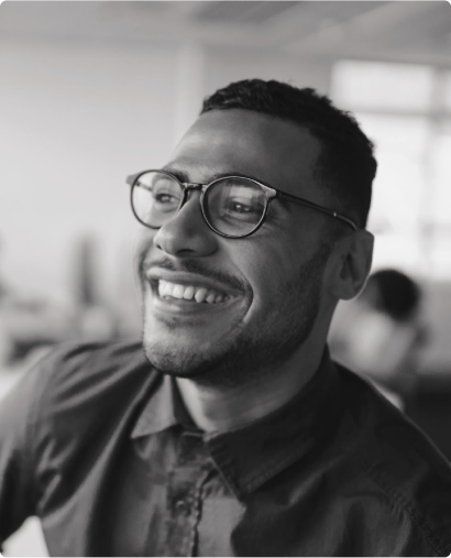 Black man with glasses smiling